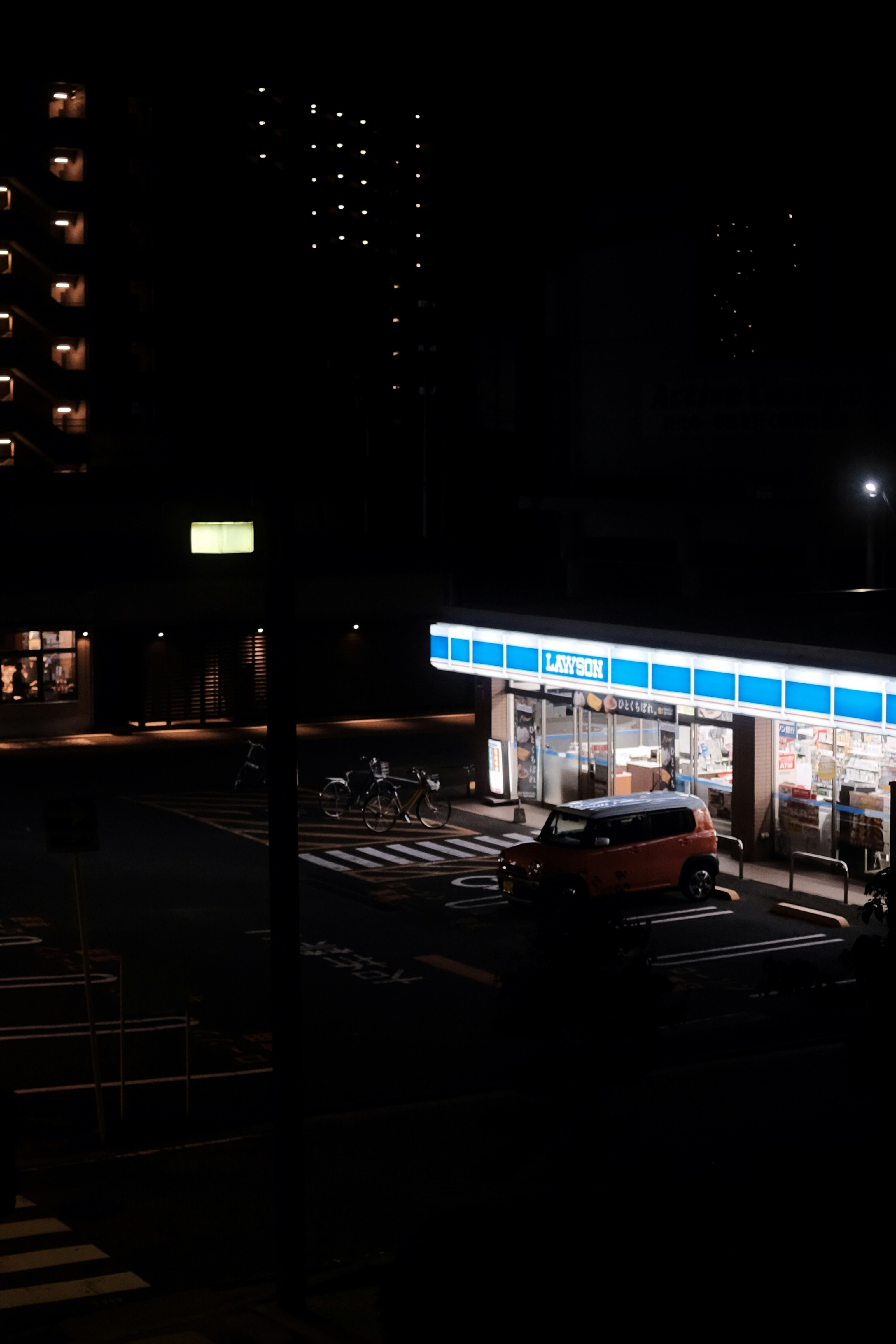 white bus on road during night time